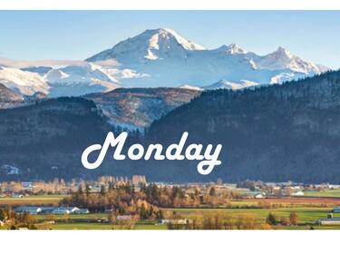 Snow covered mountains looking over the valley