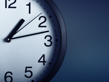Clock displaying the time as 1:13 with a dark background.